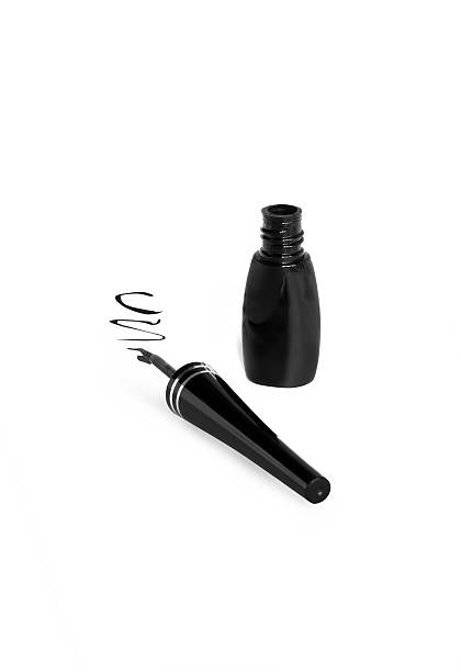 Open black eyeliner and wavy line painted by it on a white background isolated