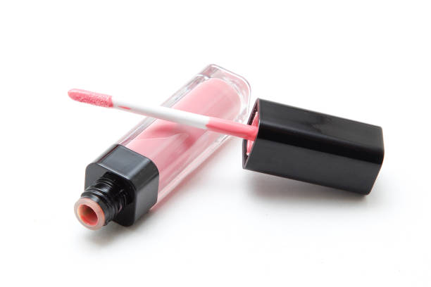 Pink lip gloss on white background