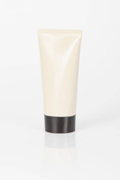 Skin cream container with black lid; photo on white background.