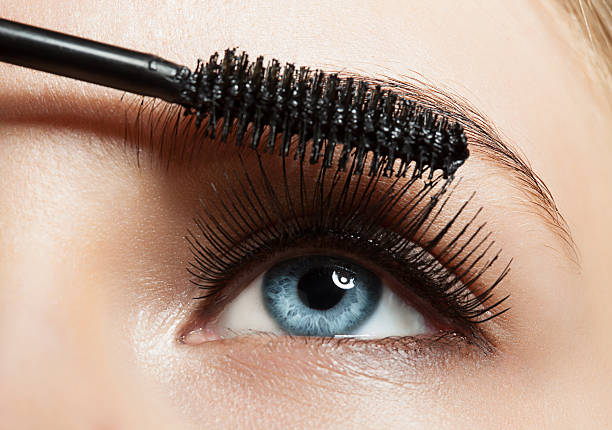Close up of make up blue eye with long lashes with black mascara